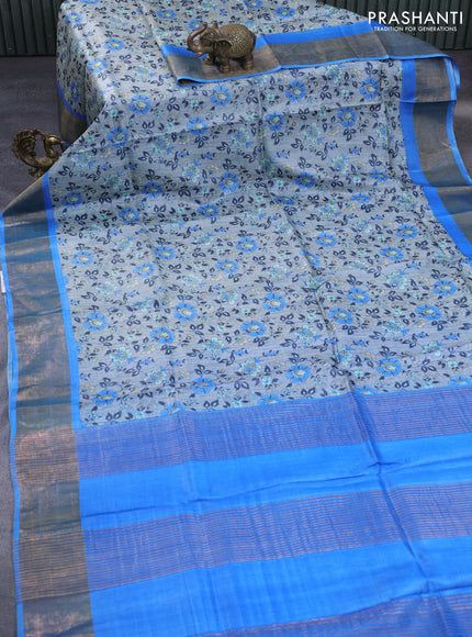 Pure tussar silk saree grey and cs blue with allover floral prints and zari woven border