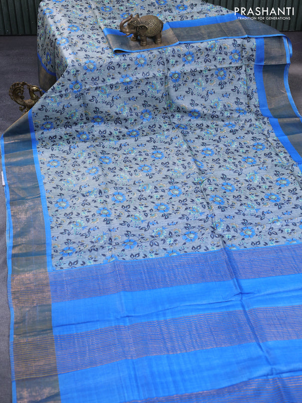 Pure tussar silk saree grey and cs blue with allover floral prints and zari woven border