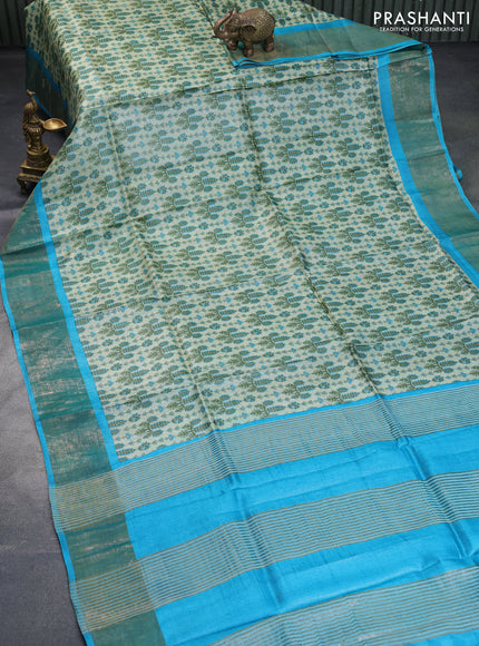 Pure tussar silk saree elaichi green and teal blue with allover prints and zari woven border