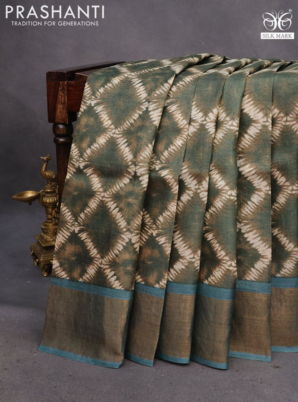 Pure tussar silk saree sap green and blue shade with allover prints and zari woven border