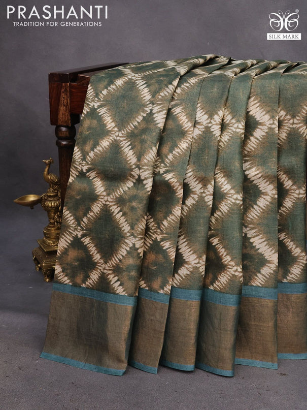 Pure tussar silk saree sap green and blue shade with allover prints and zari woven border