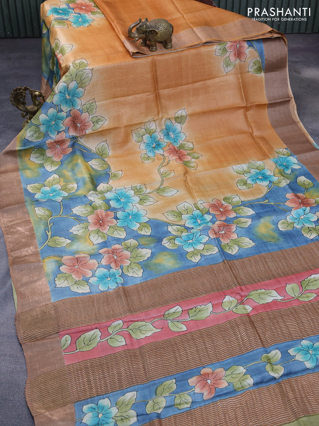 Pure tussar silk saree pale orange and blue brown with floral hand painted prints and zari woven border