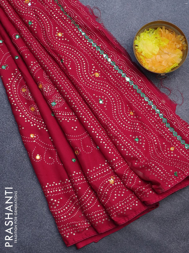 Semi georgette saree reddish pink with allover bandhani prints and mirror work printed border