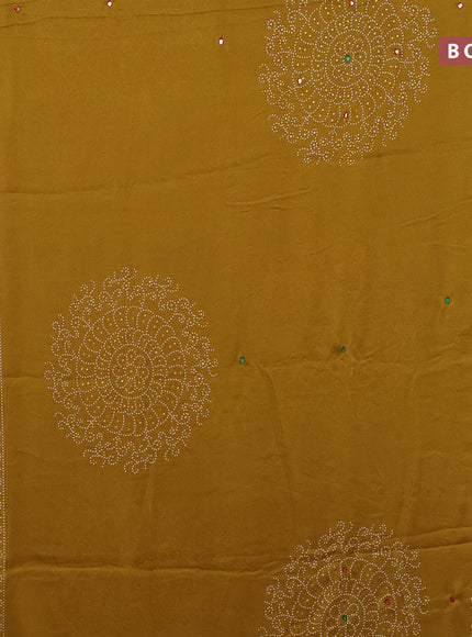 Semi georgette saree mustard yellow with allover bandhani prints and mirror work printed border