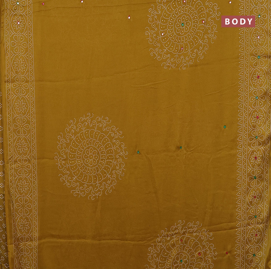 Semi georgette saree mustard yellow with allover bandhani prints and mirror work printed border