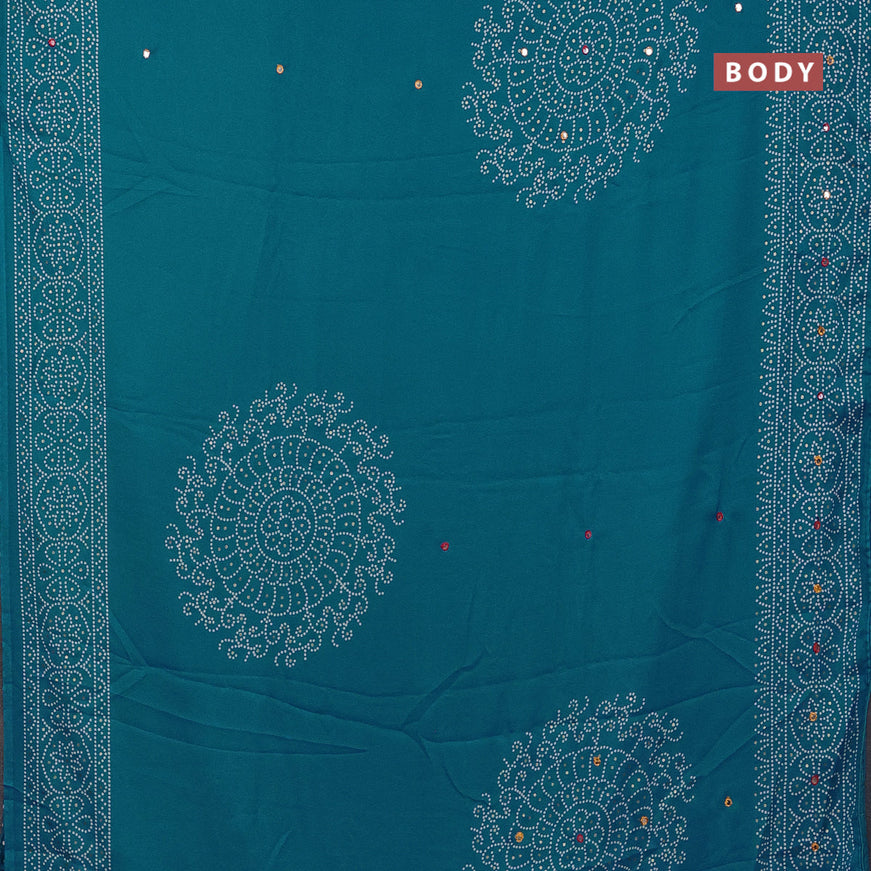 Semi georgette saree cs blue with allover bandhani prints and mirror work printed border