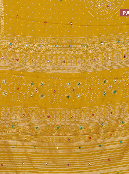 Semi georgette saree yellow with allover bandhani prints and mirror work printed border