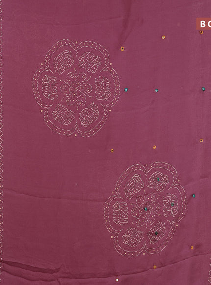 Semi georgette saree pastel pink shade with allover bandhani prints and mirror work printed border