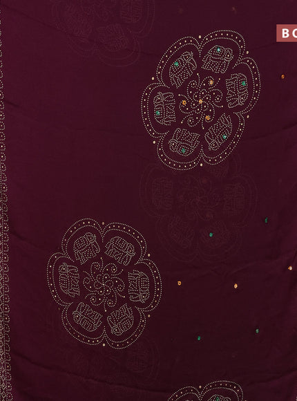 Semi georgette saree wine shade with allover bandhani prints and mirror work printed border