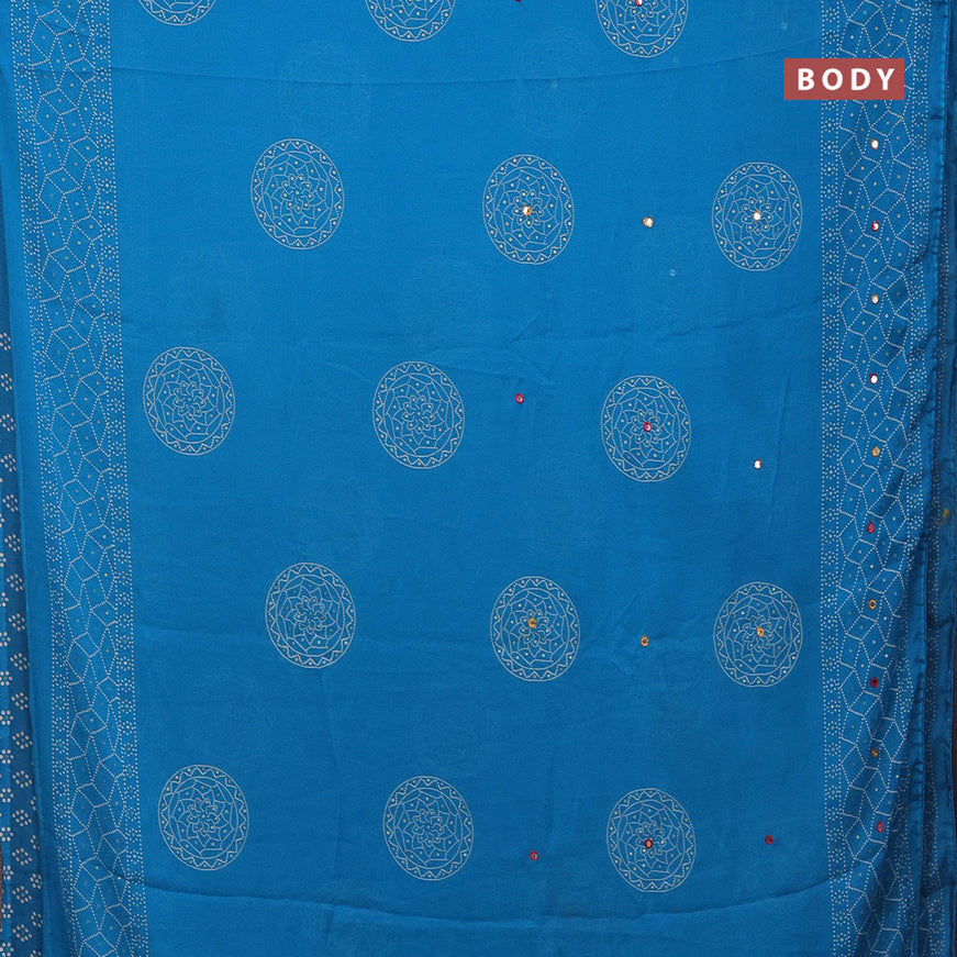 Semi georgette saree cs blue with allover bandhani prints and mirror work printed border