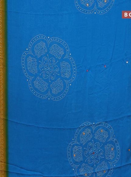 Semi georgette saree cs blue and dark mustard with allover bandhani prints and mirror work printed border