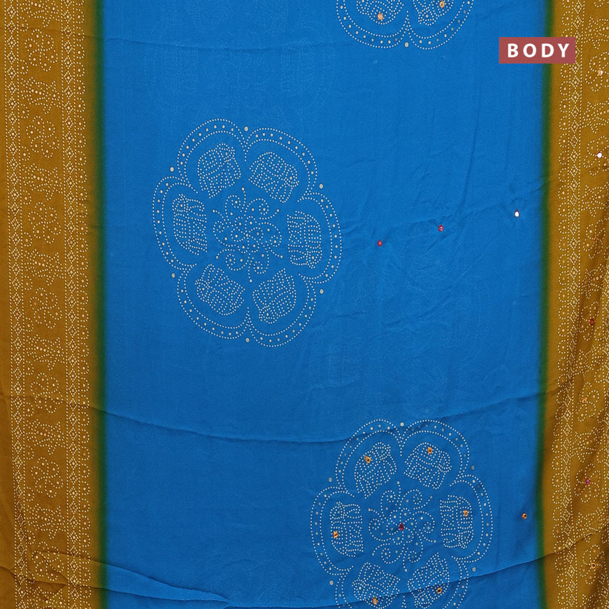 Semi georgette saree cs blue and dark mustard with allover bandhani prints and mirror work printed border