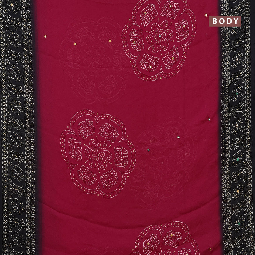 Semi georgette saree reddish pink and black with allover bandhani prints and mirror work printed border