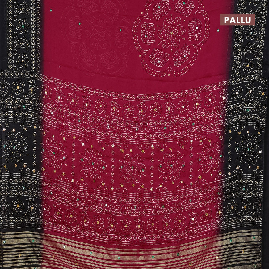 Semi georgette saree reddish pink and black with allover bandhani prints and mirror work printed border