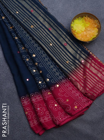 Semi georgette saree dark peaock blue and pink with allover bandhani prints and mirror work printed border