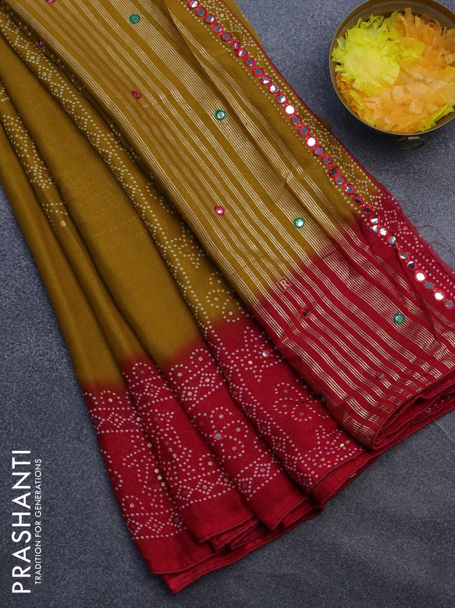 Semi georgette saree dark mustard and dark pink with allover bandhani prints and mirror work printed border