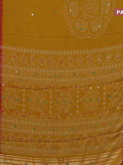 Semi georgette saree dark mustard and dark pink with allover bandhani prints and mirror work printed border