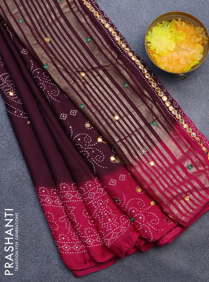 Semi georgette saree wine shade and pink with allover bandhani prints and mirror work printed border