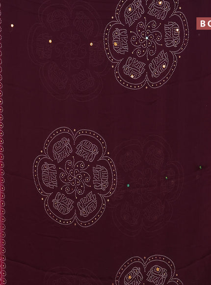 Semi georgette saree wine shade and pink with allover bandhani prints and mirror work printed border