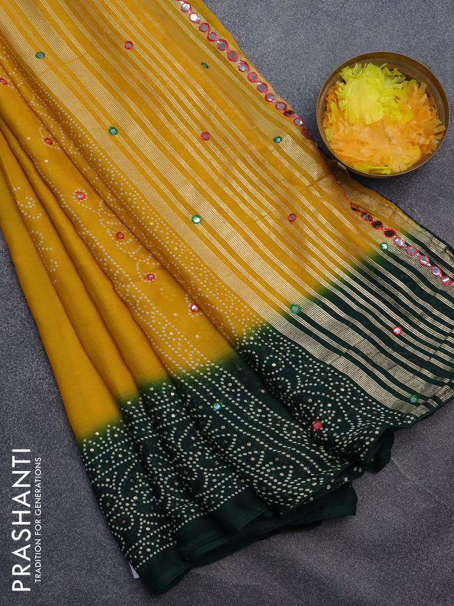 Semi georgette saree mustard yellow and bottle green with allover bandhani prints and mirror work printed border