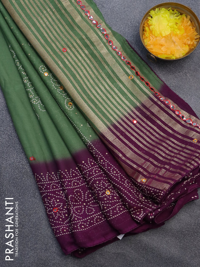 Semi georgette saree pastel green and purple with allover bandhani prints and mirror work printed border