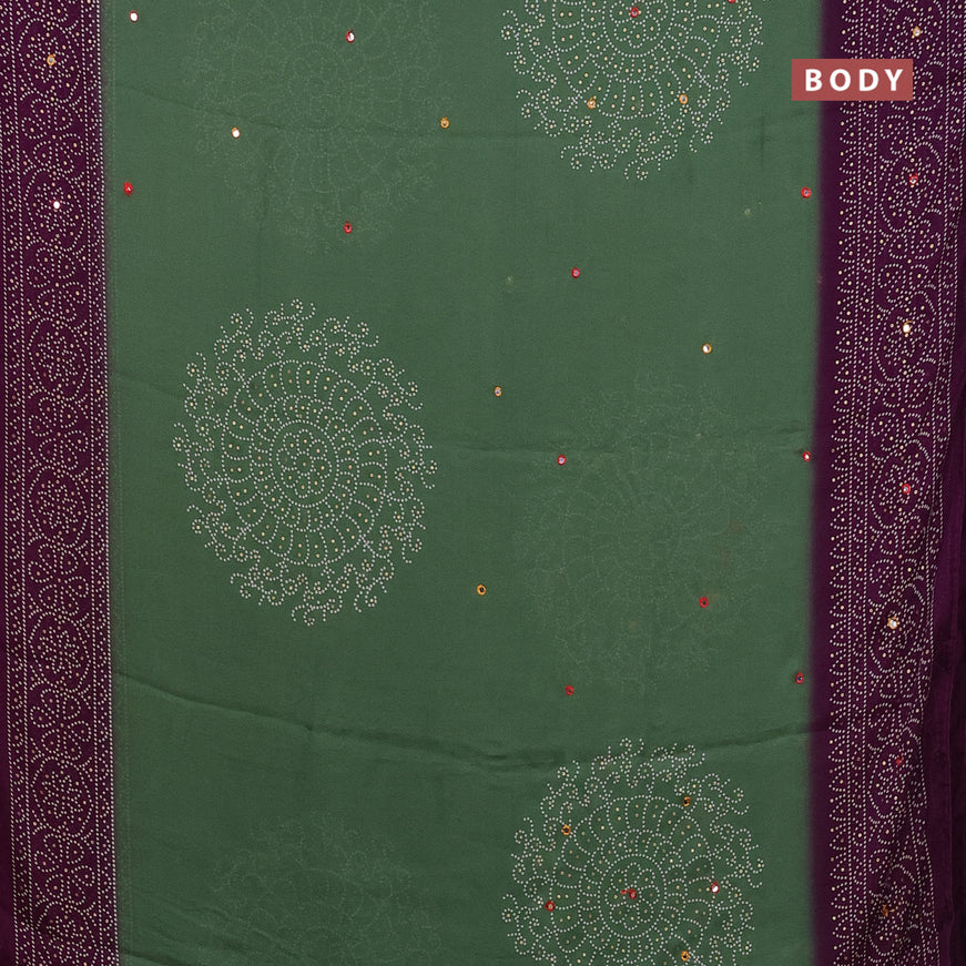 Semi georgette saree pastel green and purple with allover bandhani prints and mirror work printed border