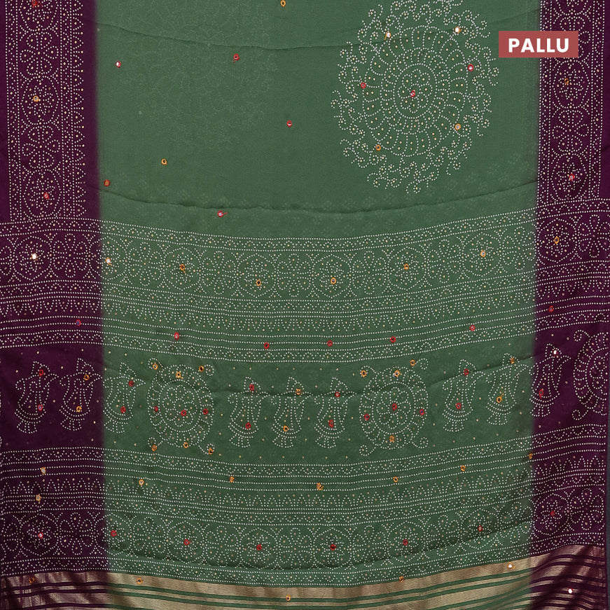 Semi georgette saree pastel green and purple with allover bandhani prints and mirror work printed border