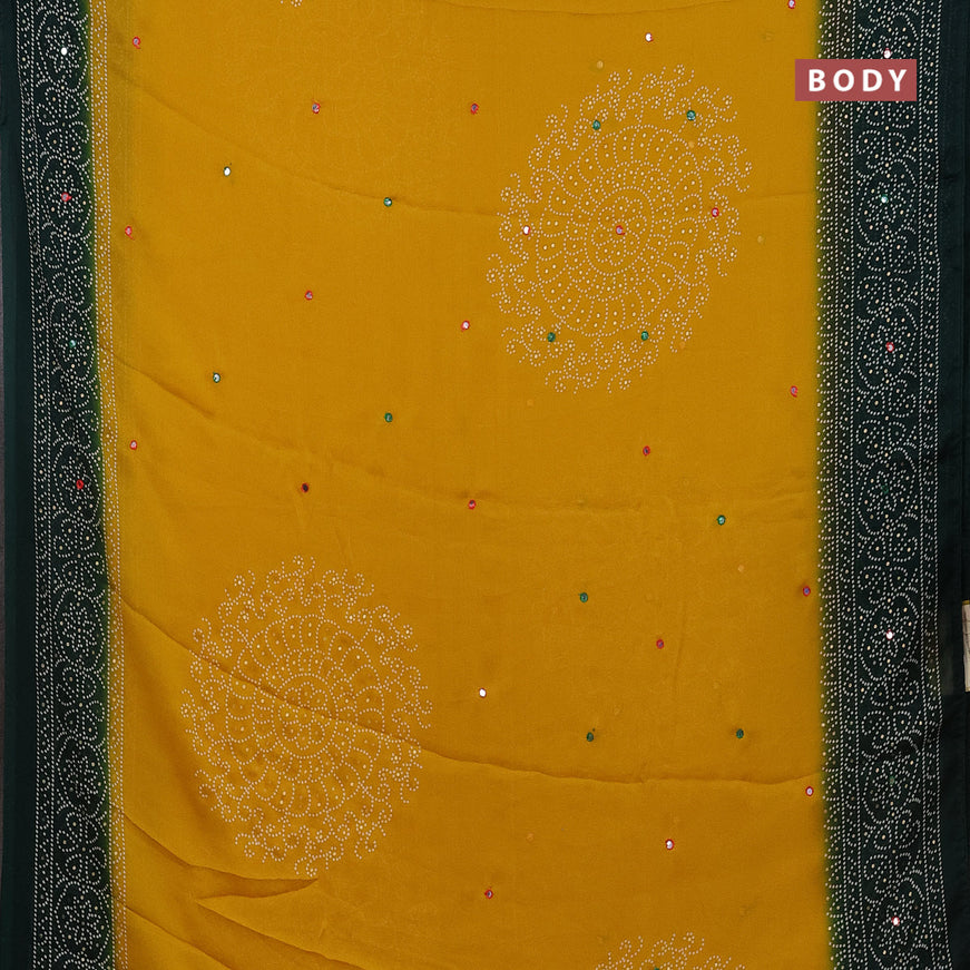 Semi georgette saree mustard yellow and bottle green with allover bandhani prints and mirror work printed border