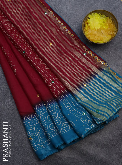 Semi georgette saree kumkum red and cs blue with allover bandhani prints and mirror work printed border