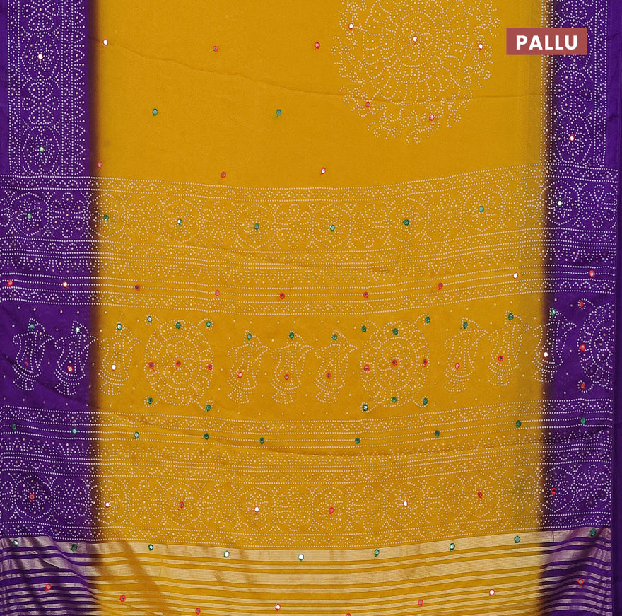 Semi georgette saree yellow and violet with allover bandhani prints and mirror work printed border