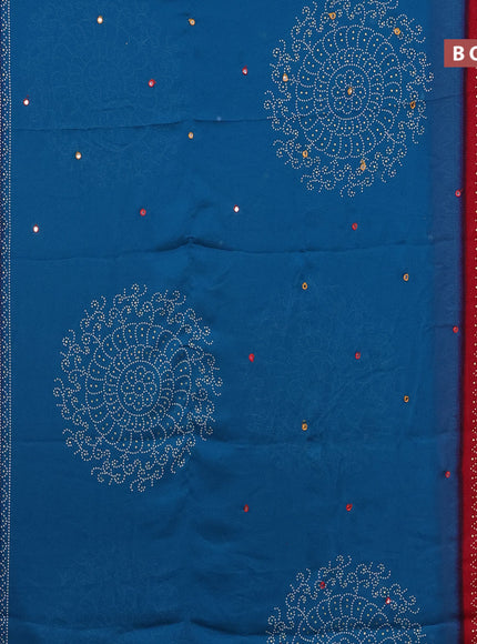 Semi georgette saree cs blue and red with allover bandhani prints and mirror work printed border