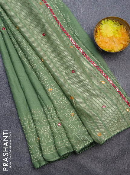 Semi georgette saree pastel green with allover bandhani prints and mirror work printed border