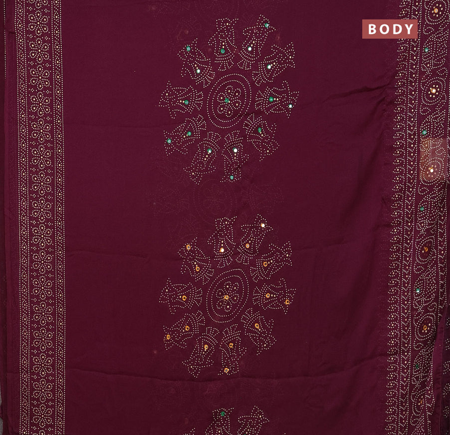 Semi georgette saree wine shade with allover bandhani prints and mirror work printed border