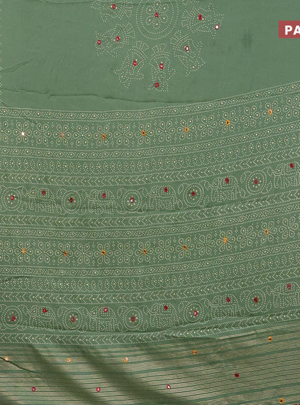 Semi georgette saree pastel green with allover bandhani prints and mirror work printed border