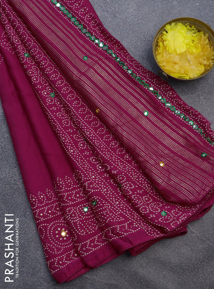 Semi georgette saree pink with allover bandhani prints and mirror work printed border