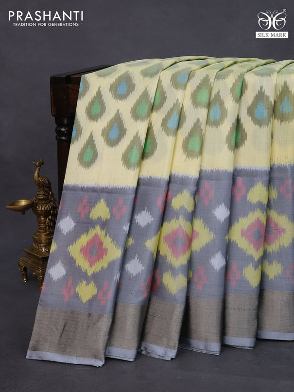 Ikat soft silk saree cream and grey with allover ikat butta weaves and long ikat woven zari border