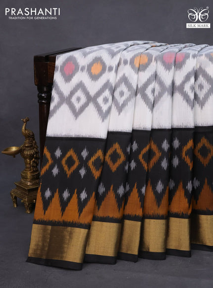 Ikat soft silk saree off white grey and black with allover ikat weaves and long ikat woven zari border