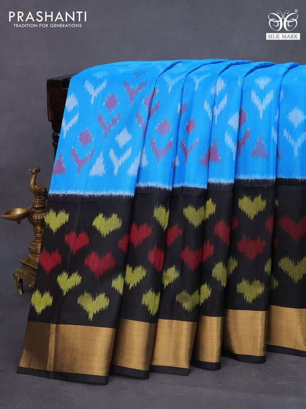 Ikat soft silk saree blue and black with allover ikat butta weaves and long ikat woven zari border