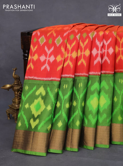 Ikat soft silk saree reddish orange and green with allover ikat weaves and long ikat woven zari border