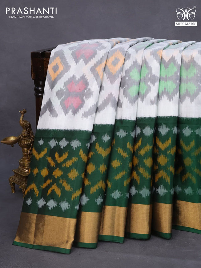 Ikat soft silk saree off white grey and bottle green with allover ikat weaves and long ikat woven zari border