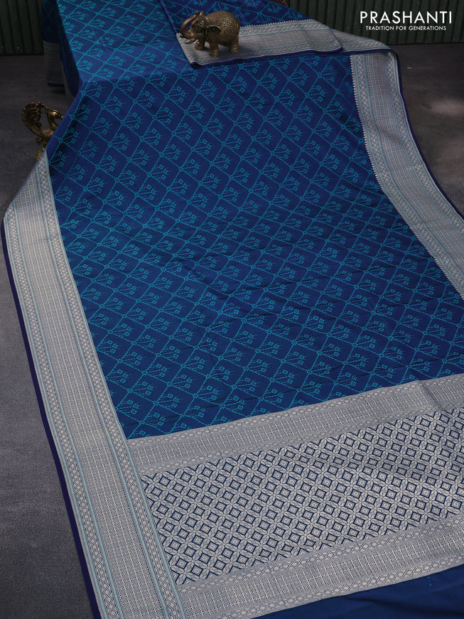 Mushru silk saree dual shade of blue and teal green with allover self emboss and rich zari woven border