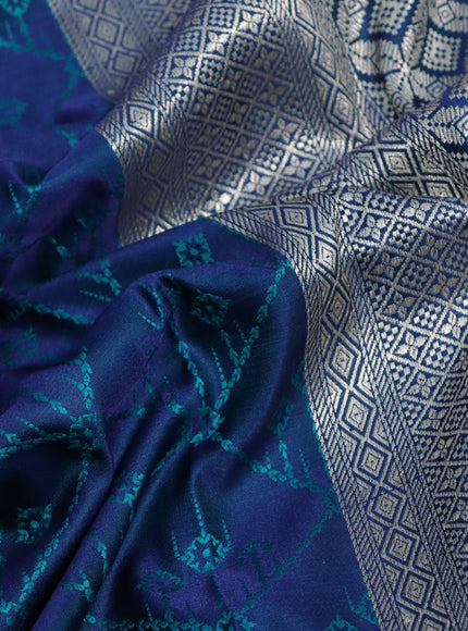 Mushru silk saree dual shade of blue and teal green with allover self emboss and rich zari woven border