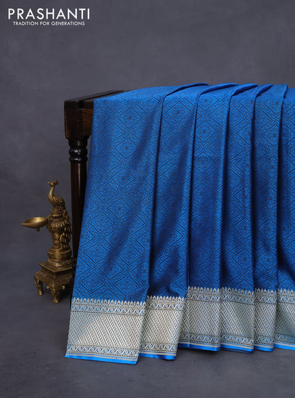 Mushru silk saree cs blue with allover self emboss and rich zari woven border