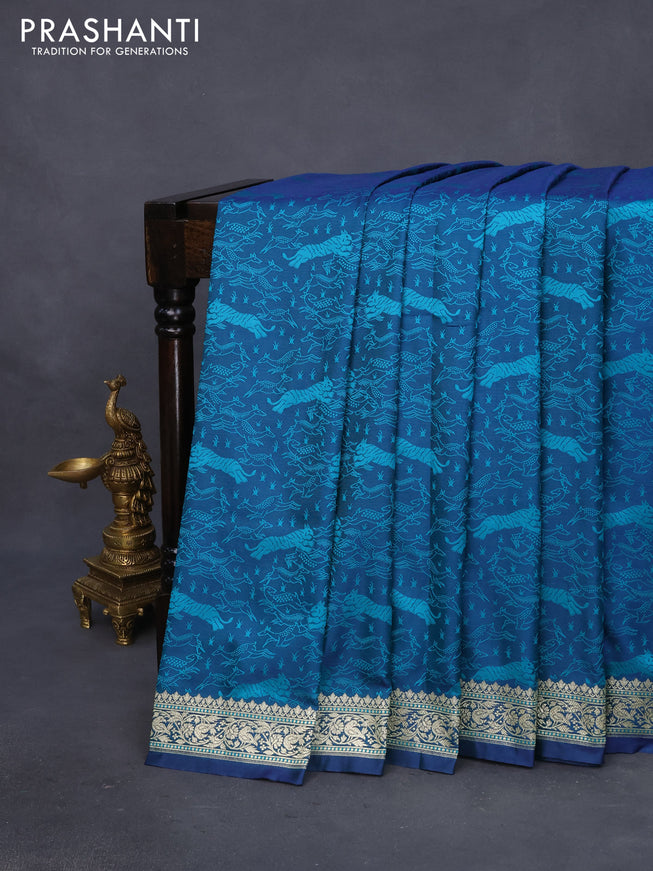 Mushru silk saree dual shade of bluish teal green with allover self emboss and rich zari woven border