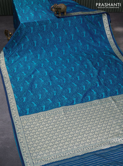 Mushru silk saree dual shade of bluish teal green with allover self emboss and rich zari woven border