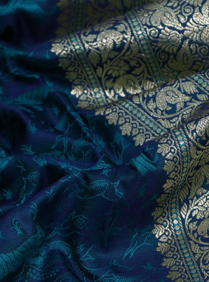 Mushru silk saree dual shade of bluish teal green with allover self emboss and rich zari woven border