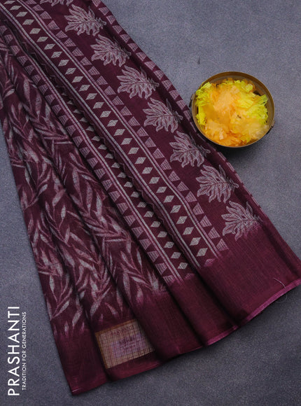 Jute cotton saree wine shade with allover leaf prints and simple border