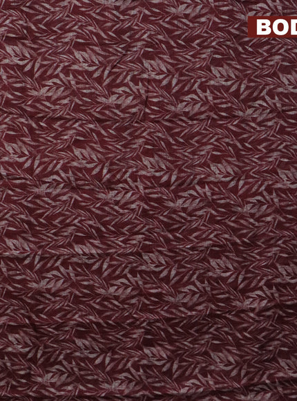 Jute cotton saree deep maroon with allover leaf prints and simple border