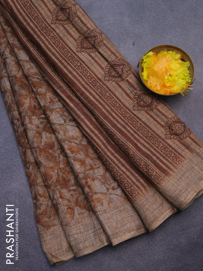 Jute cotton saree brown shade with allover floral prints and simple border