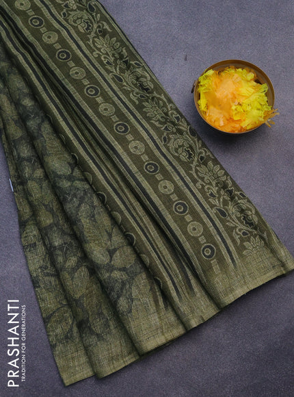 Jute cotton saree dark sap green and mehendi green with allover leaf prints and simple border